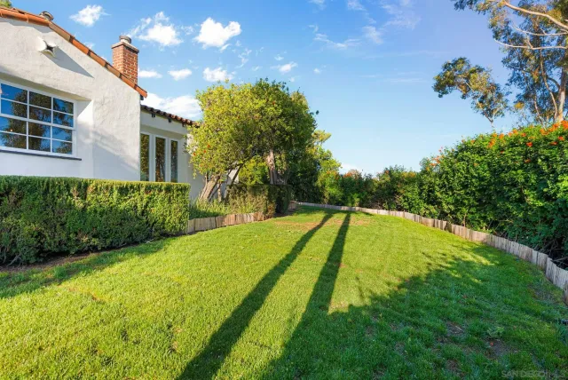 a view of a swimming pool with a yard