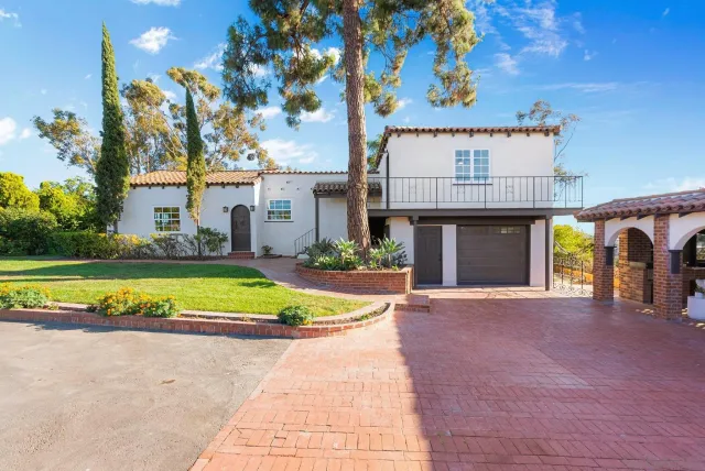 a living room with furniture fireplace and window