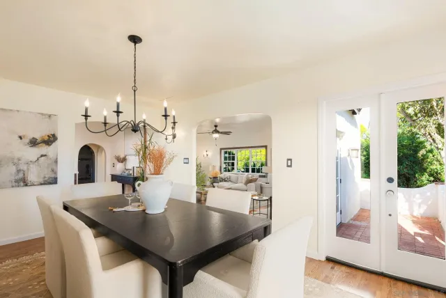 a kitchen with a sink a refrigerator and cabinets