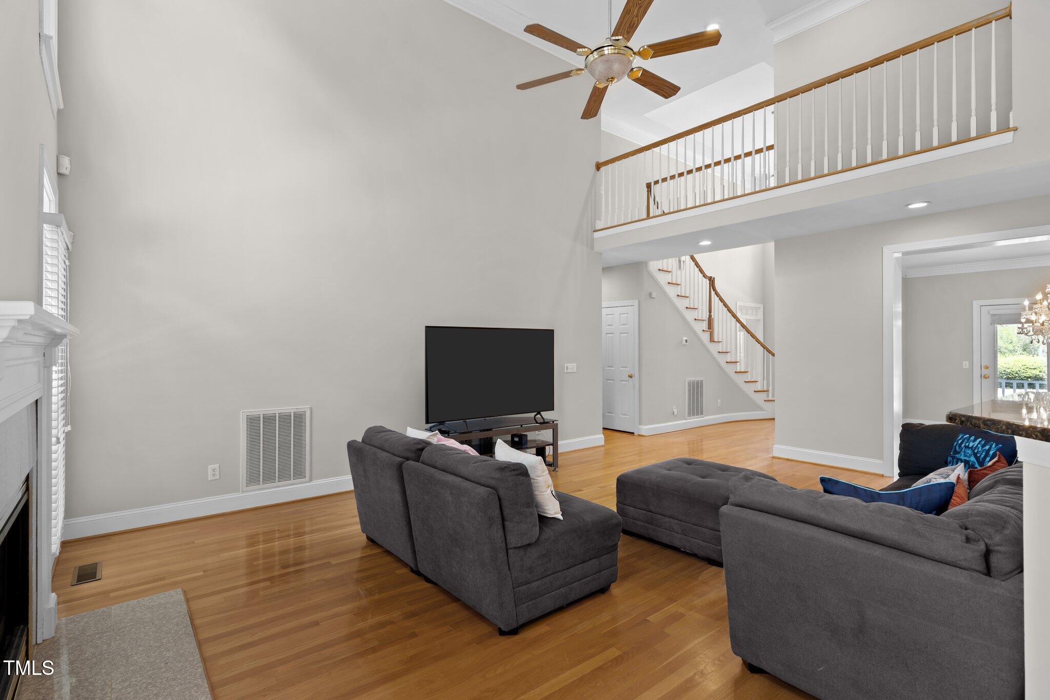 3556 Iris Street Wilmington, NC 28409 - Photo 11 of 52 a living room with furniture and a flat screen tv