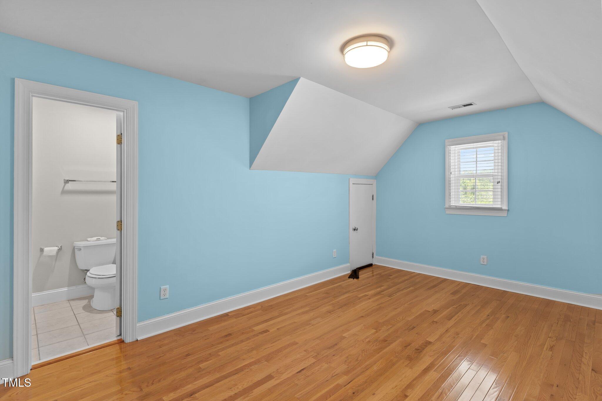 3556 Iris Street Wilmington, NC 28409 - Photo 33 of 52 wooden floor in an empty room with a window