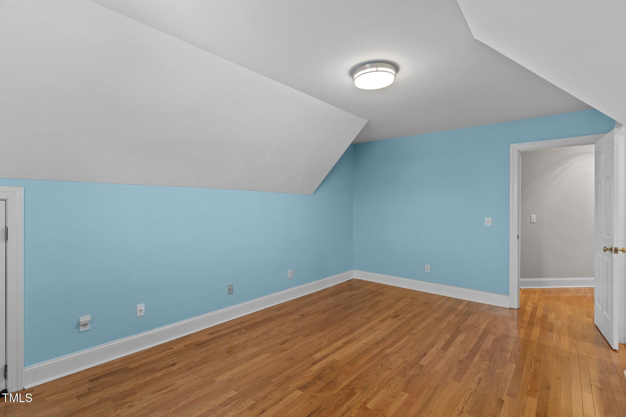 3556 Iris Street Wilmington, NC 28409 - Photo 34 of 52 a view of room with wooden floor