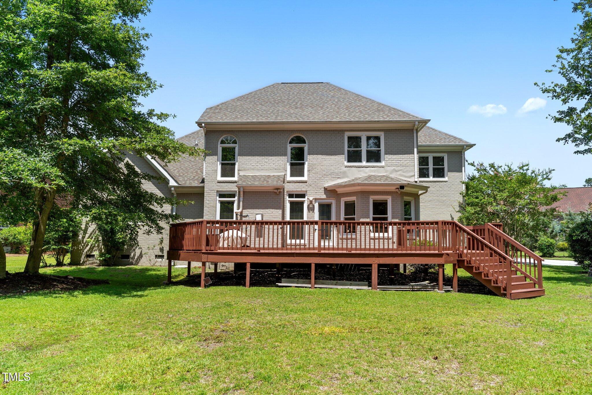 3556 Iris Street Wilmington, NC 28409 - Photo 42 of 52 a front view of house with yard and green space