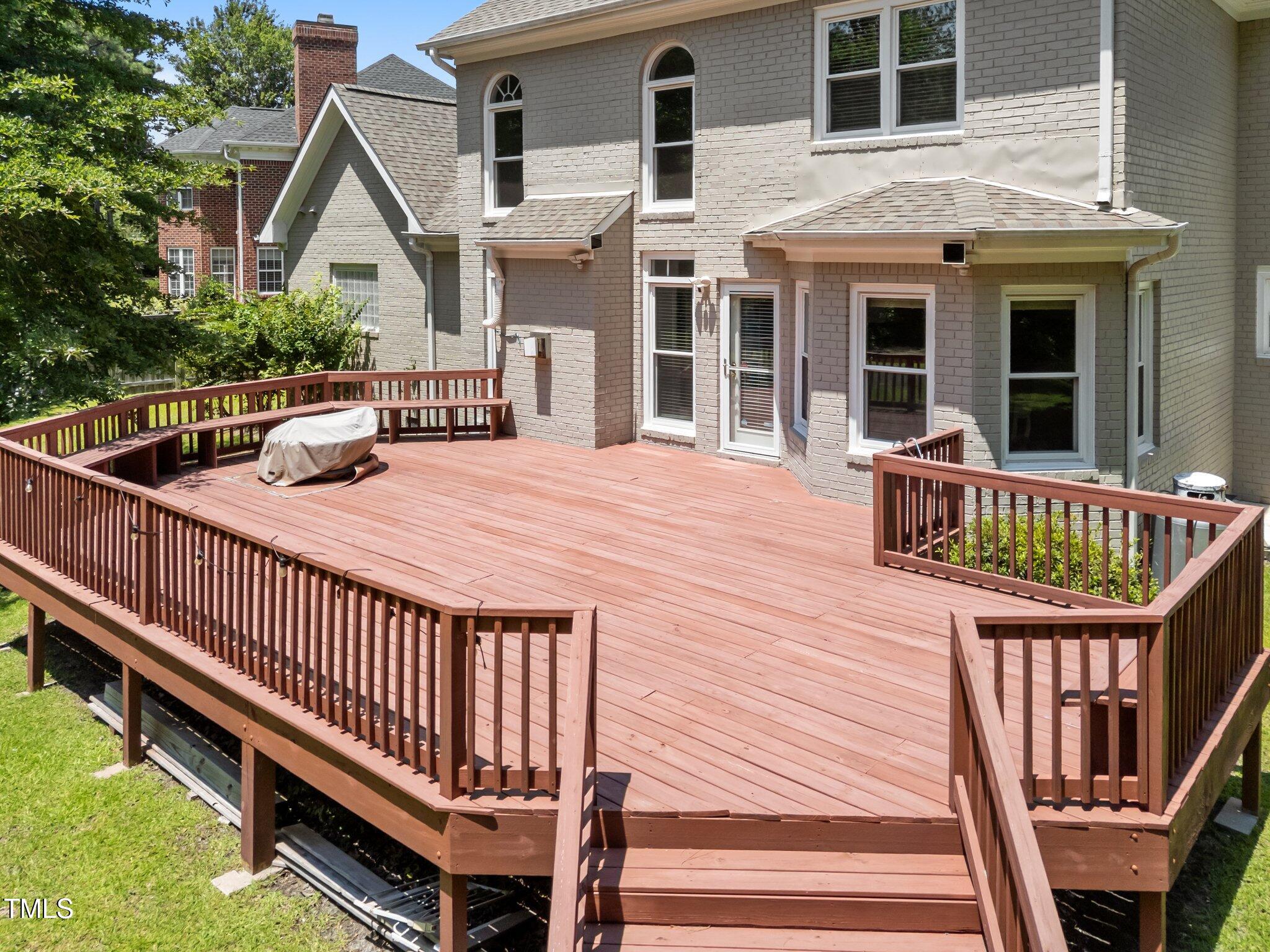 3556 Iris Street Wilmington, NC 28409 - Photo 46 of 52 a balcony with wooden floor and outdoor seating
