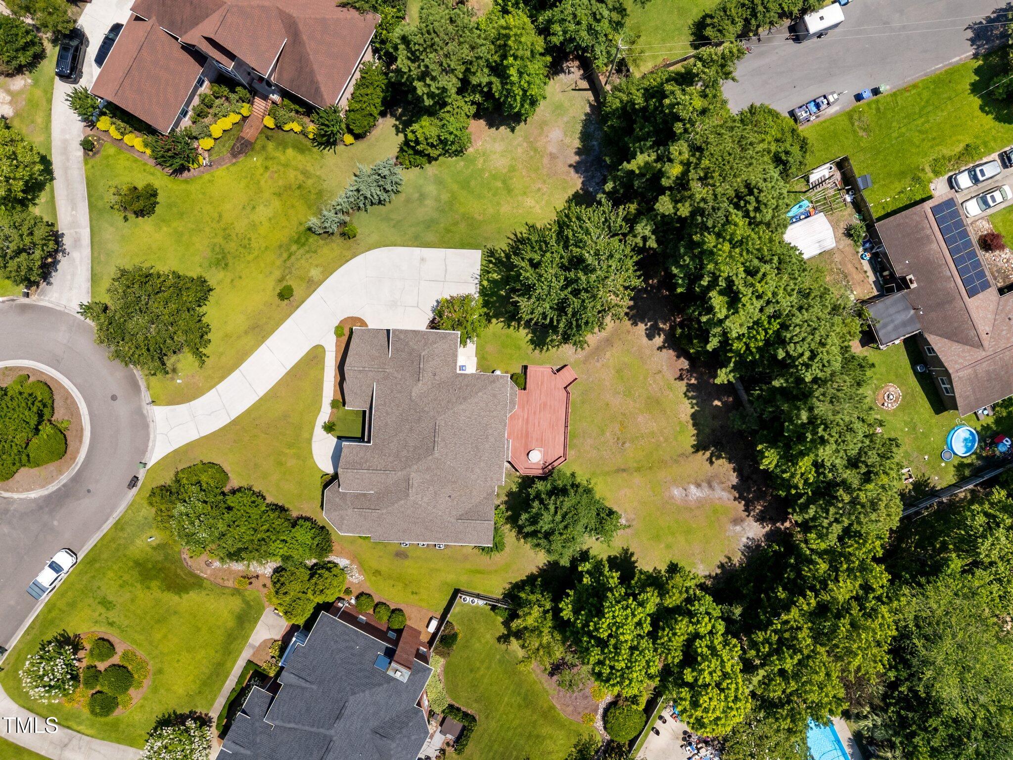 3556 Iris Street Wilmington, NC 28409 - Photo 48 of 52 an aerial view of a house with a yard and lake view