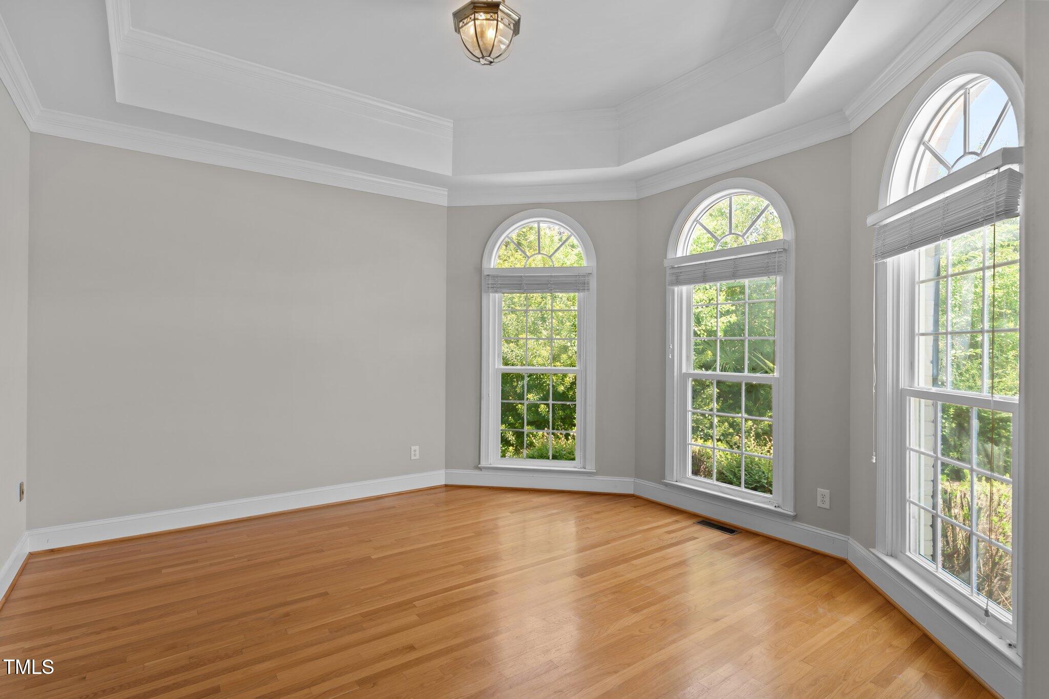 3556 Iris Street Wilmington, NC 28409 - Photo 5 of 52 a view of an empty room with a window