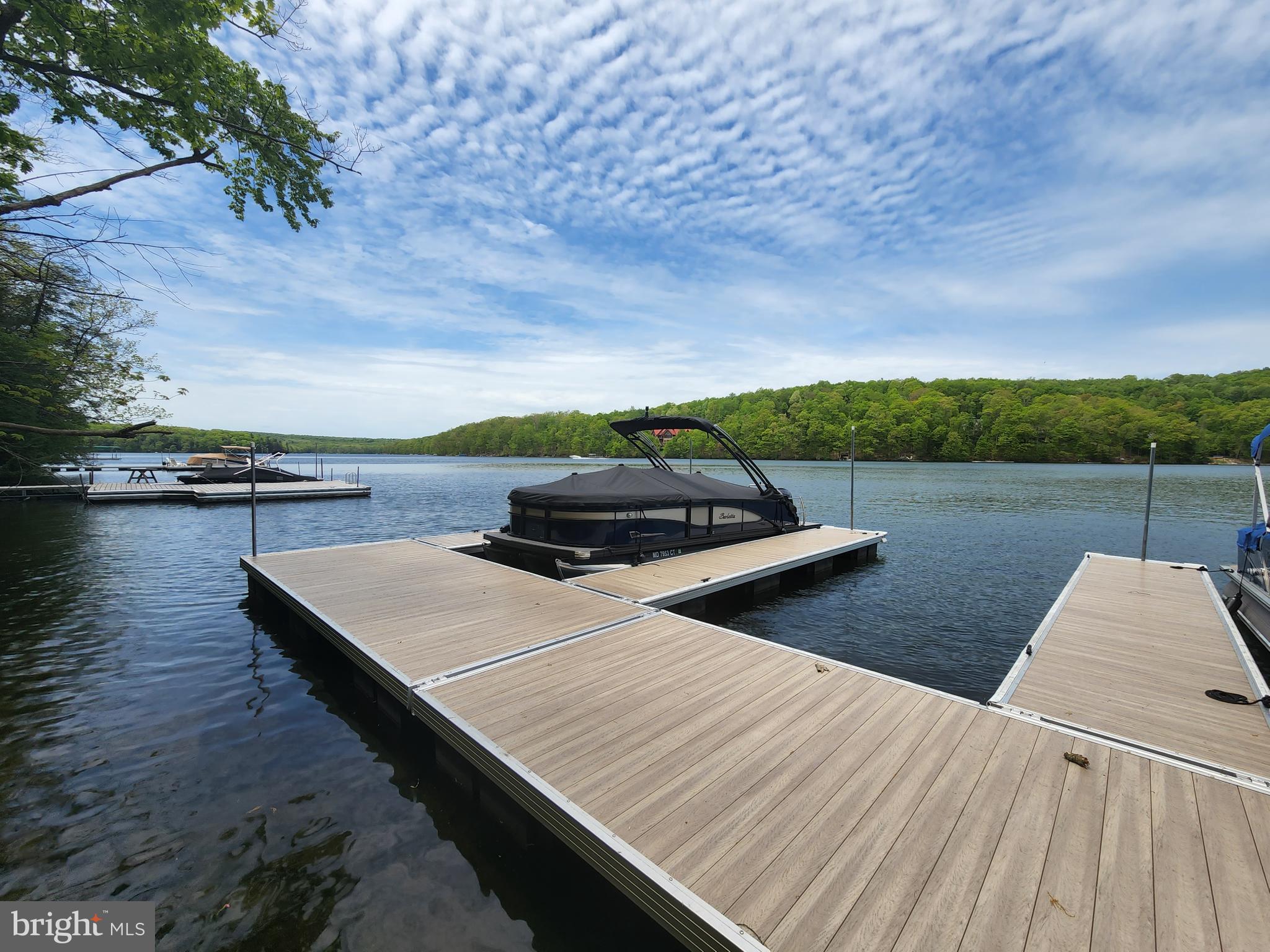 Edgewater Drive, Unit 4 Oakland, MD 21550 - Photo 2 of 16 a view of a terrace with wooden floor and lake view