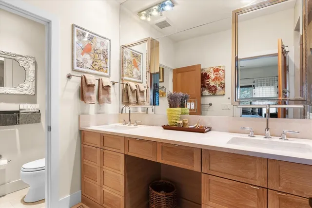 a bed room with a bed and a chair