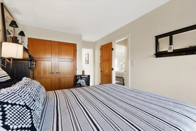 a bathroom with a sink vanity toilet and a mirror