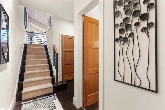 a kitchen with stainless steel appliances a table a stove and a refrigerator