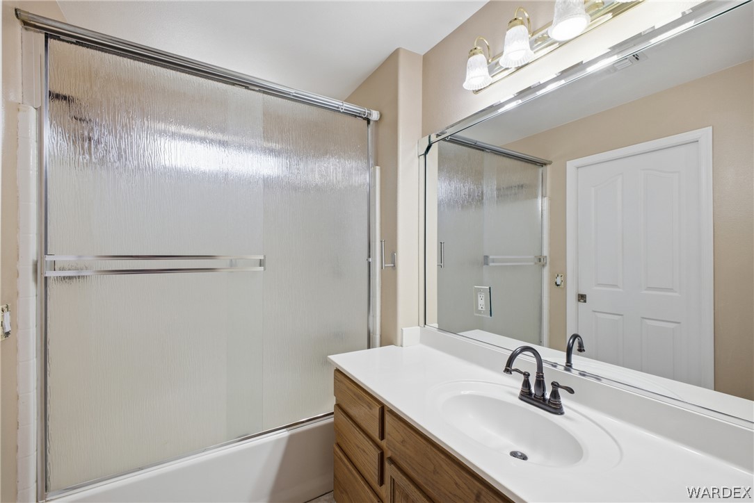 3918 North Eagle Rock Road Kingman, AZ 86409 - Photo 28 of 44 a bathroom with a sink and a mirror