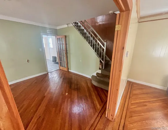 a view of stairs and wooden floor