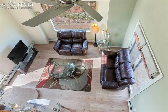 a view of living room with furniture and a flat screen tv