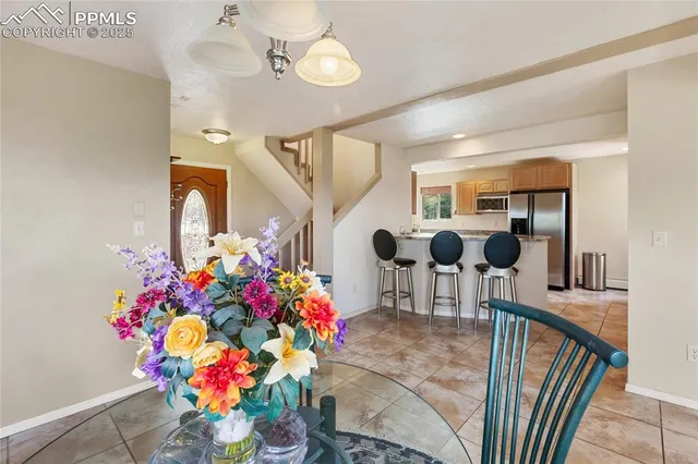 a kitchen with a sink window and cabinets