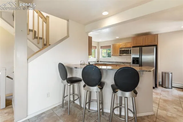 a dining room with furniture and chandelier