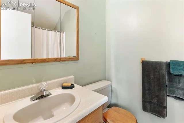 a bathroom with a sink vanity and a mirror