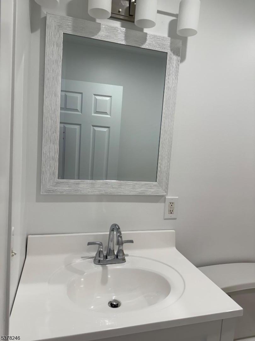 22 Baldwin Street, Unit 2 Montclair, NJ 07042 - Photo 14 of 20 a bathroom with a sink and a mirror
