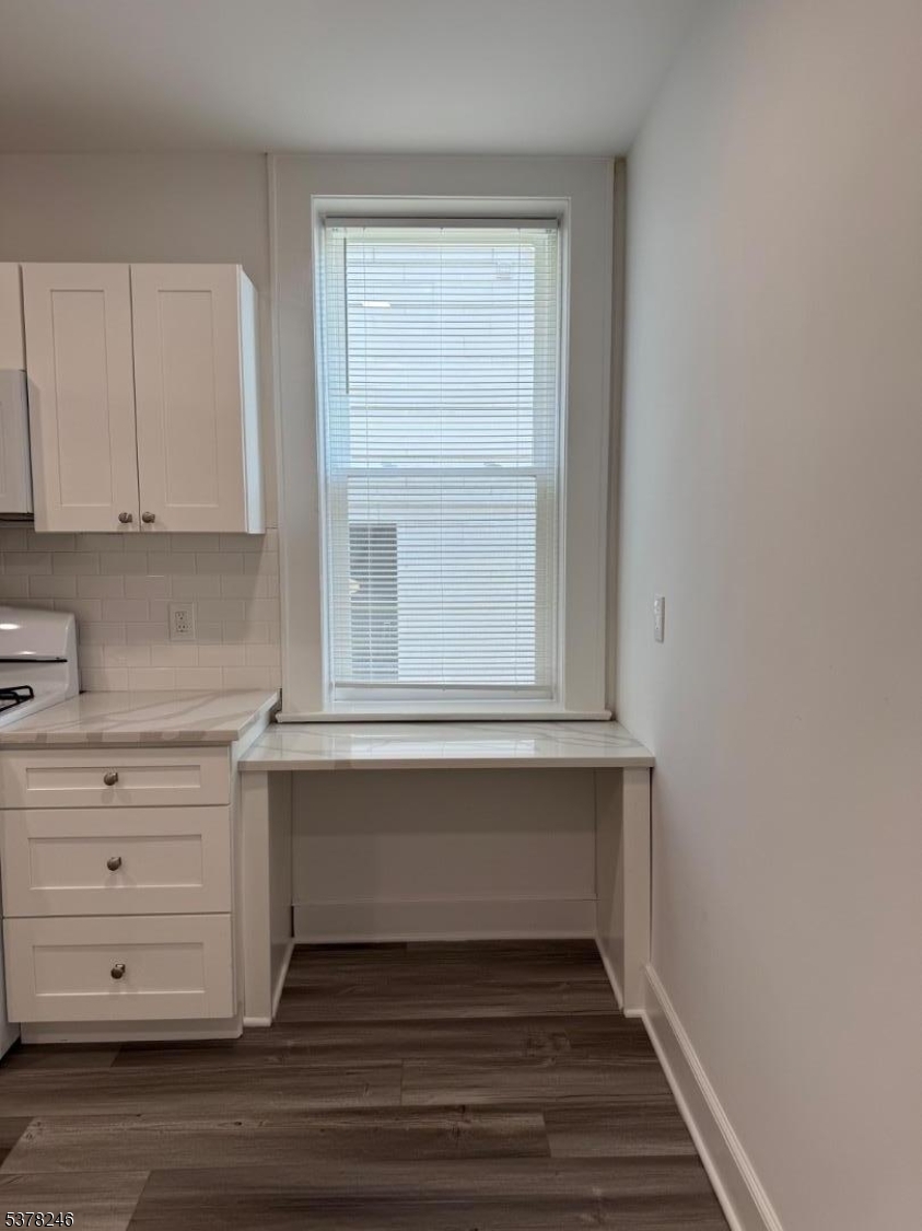 22 Baldwin Street, Unit 2 Montclair, NJ 07042 - Photo 3 of 20 a view of cabinet and window in an empty room