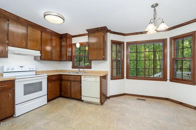 a kitchen that has a sink and a stove