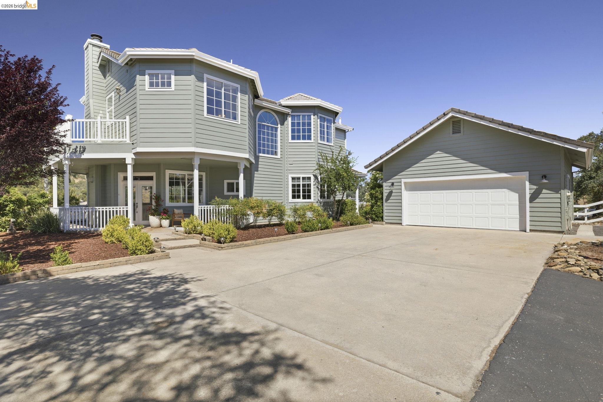 6242 Bluff View Road Copperopolis, CA 95228 - Photo 3 of 59 Freshly Painted Exterior with private driveway entrance and detached two car garage