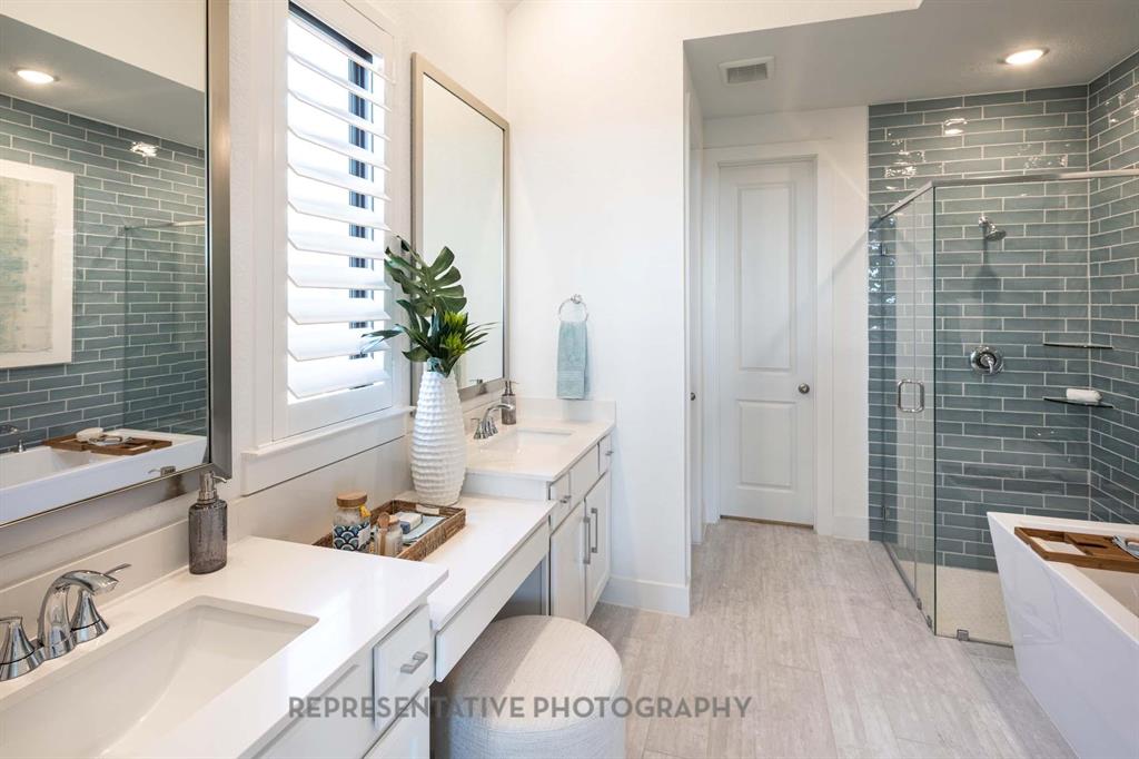 4022 Windy Point Court Oak Point, TX 75068 - Photo 12 of 33 Full bathroom featuring a shower stall, a soaking tub, light wood-style flooring, recessed lighting, and vanity