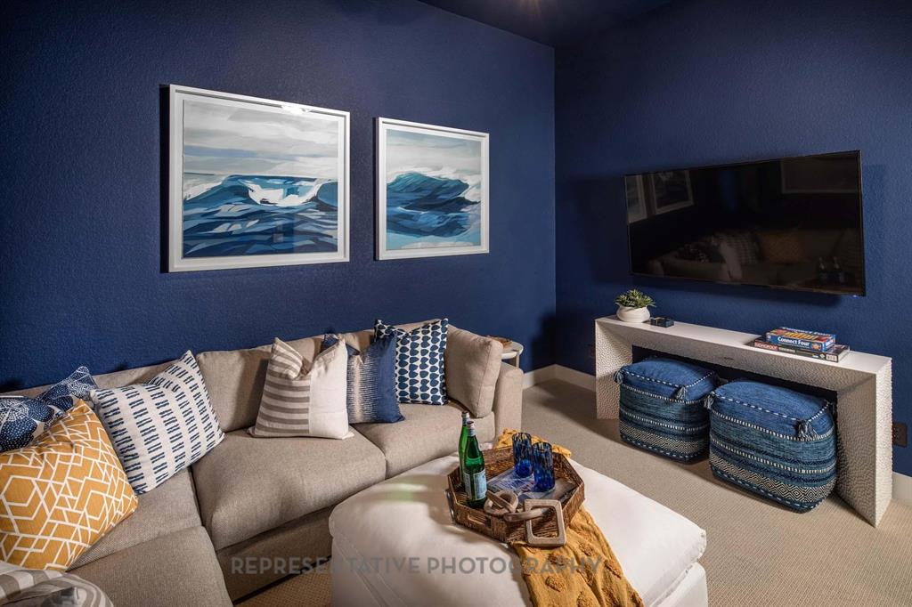 4022 Windy Point Court Oak Point, TX 75068 - Photo 26 of 33 Carpeted living area with baseboards