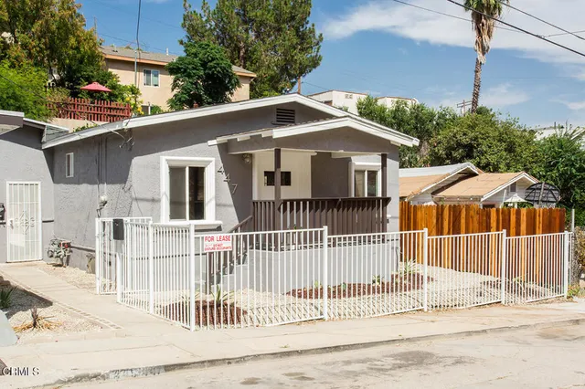 a front view of a house with a porch