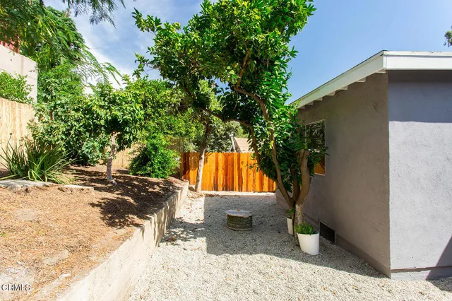 a view of a backyard of the house