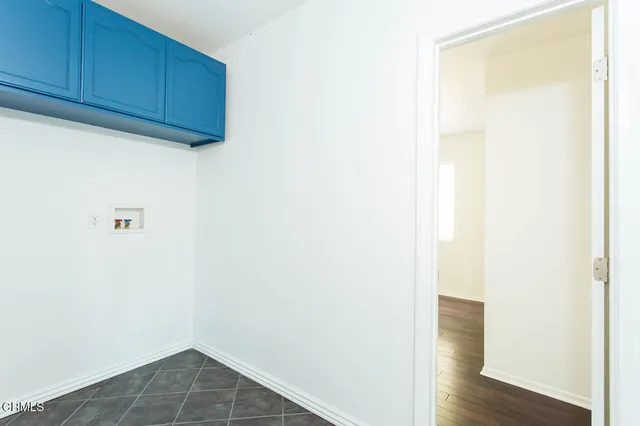 a view of door with wooden floor