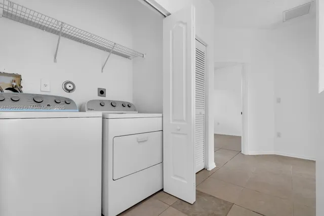 a utility room with dryer and washer