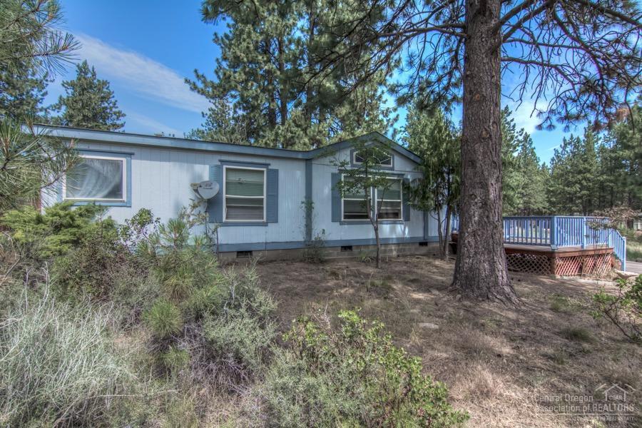 60041 Hopi Road Bend, OR 97702 - Photo 2 of 19 front view of a house with a trees