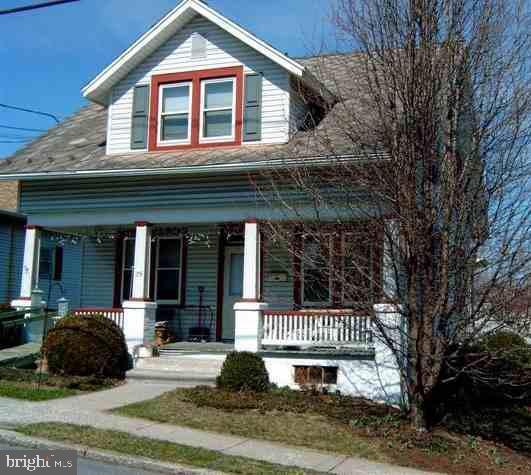 25 Duke Street Hershey, PA 17033 - Photo 1 of 22 a view of a brick house with large windows and a large tree
