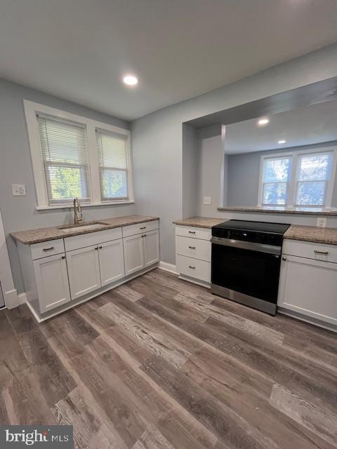 25 Duke Street Hershey, PA 17033 - Photo 8 of 22 a large white kitchen with granite countertop a stove and a sink