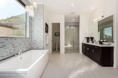 a kitchen with stainless steel appliances granite countertop a stove and a refrigerator