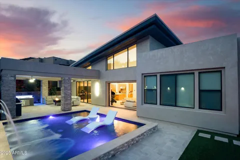 a backyard of a house with outdoor seating