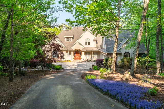 a living room with furniture and large windows