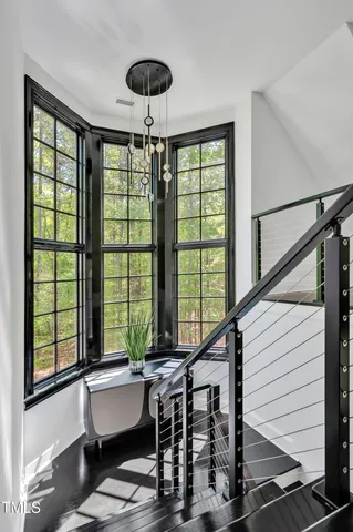 a view of a patio with a table chairs and a backyard