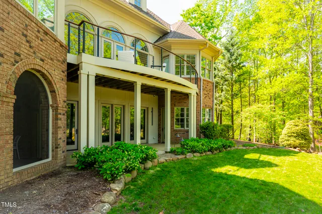 a living room with fireplace furniture and a large window