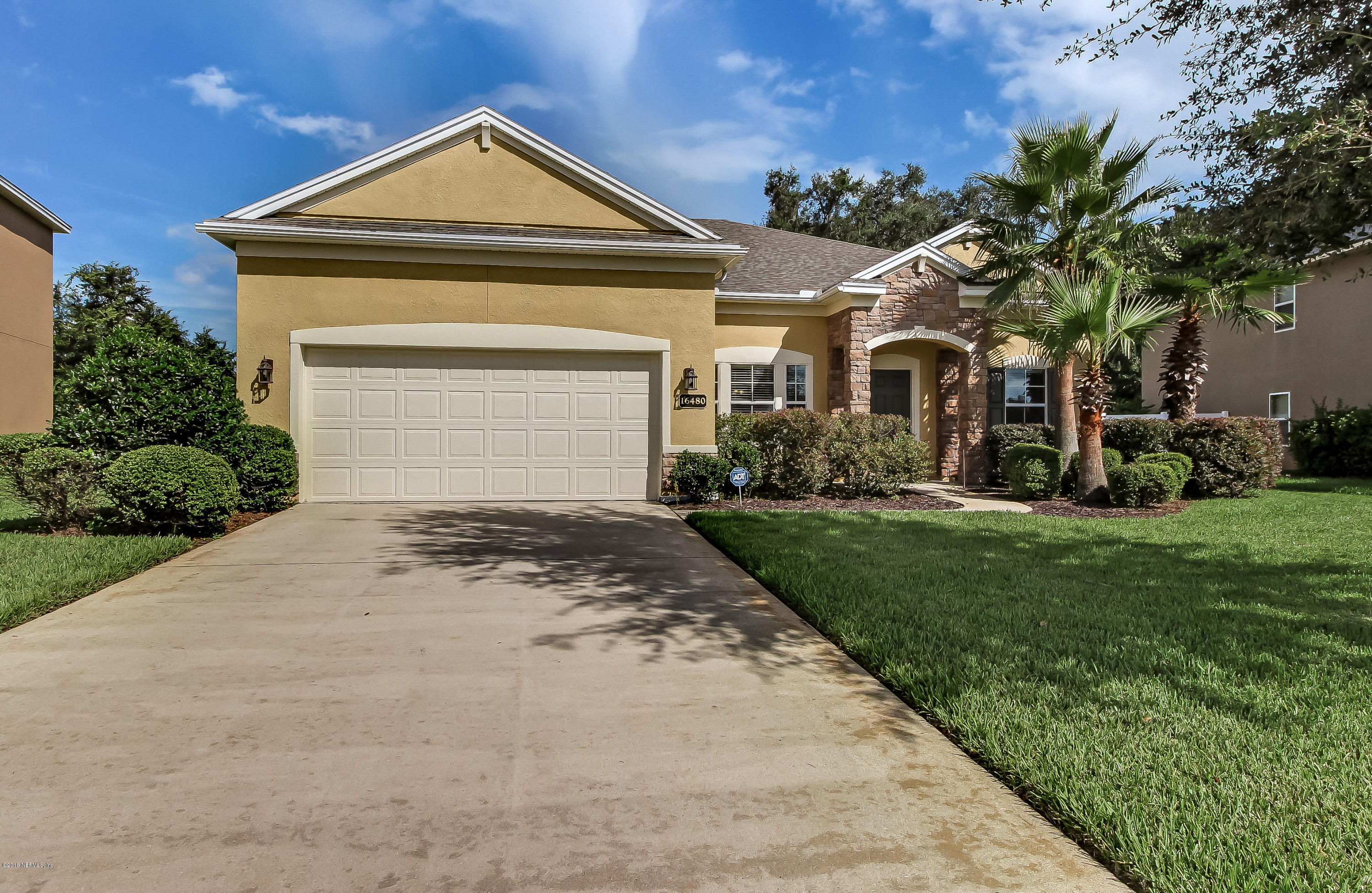 16480 Tisons Bluff Road Jacksonville, FL 32218 - Photo 2 of 80 a front view of a house with a yard and garage