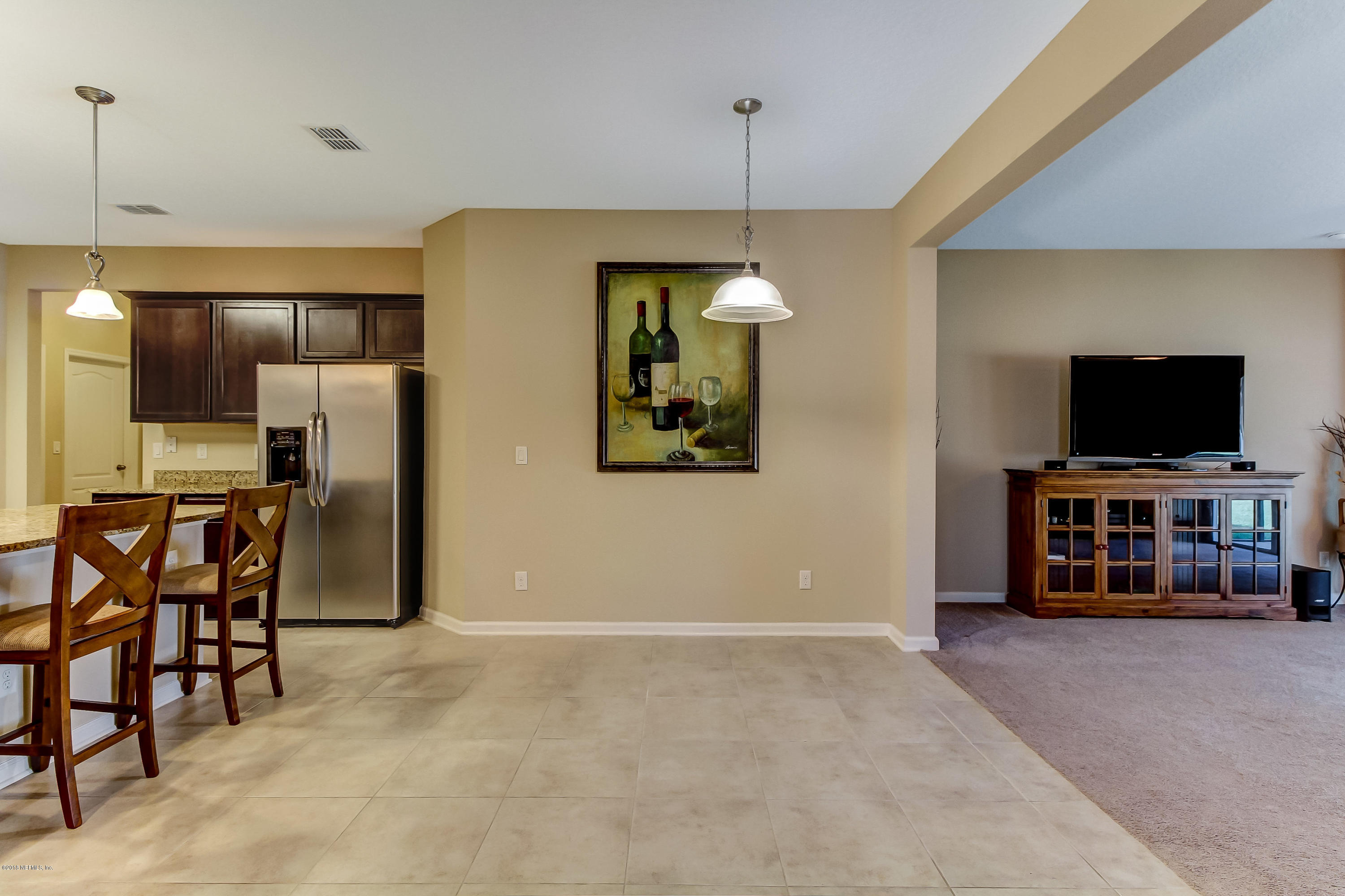 16480 Tisons Bluff Road Jacksonville, FL 32218 - Photo 21 of 80 a view of a livingroom with furniture and a flat screen tv