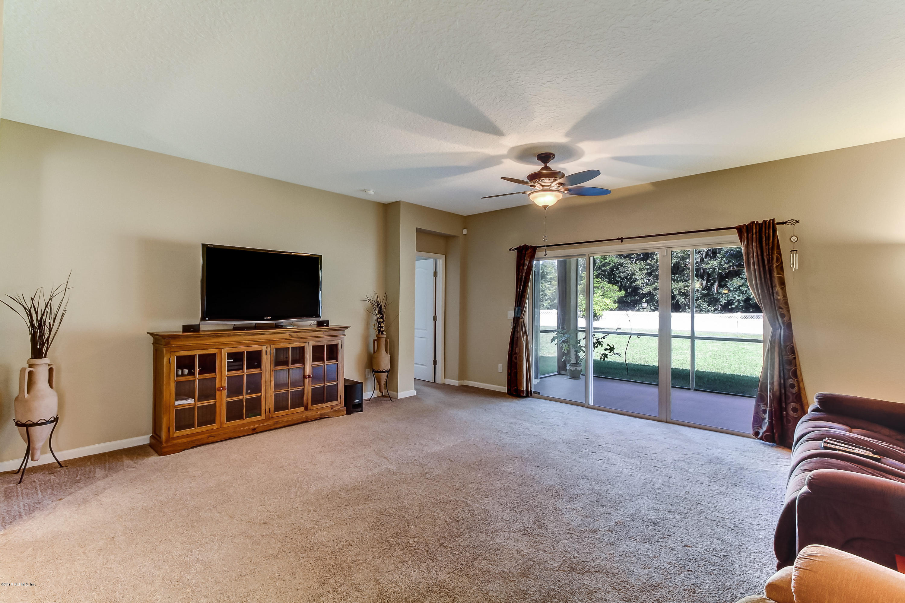16480 Tisons Bluff Road Jacksonville, FL 32218 - Photo 22 of 80 a view of room with window and flat screen tv