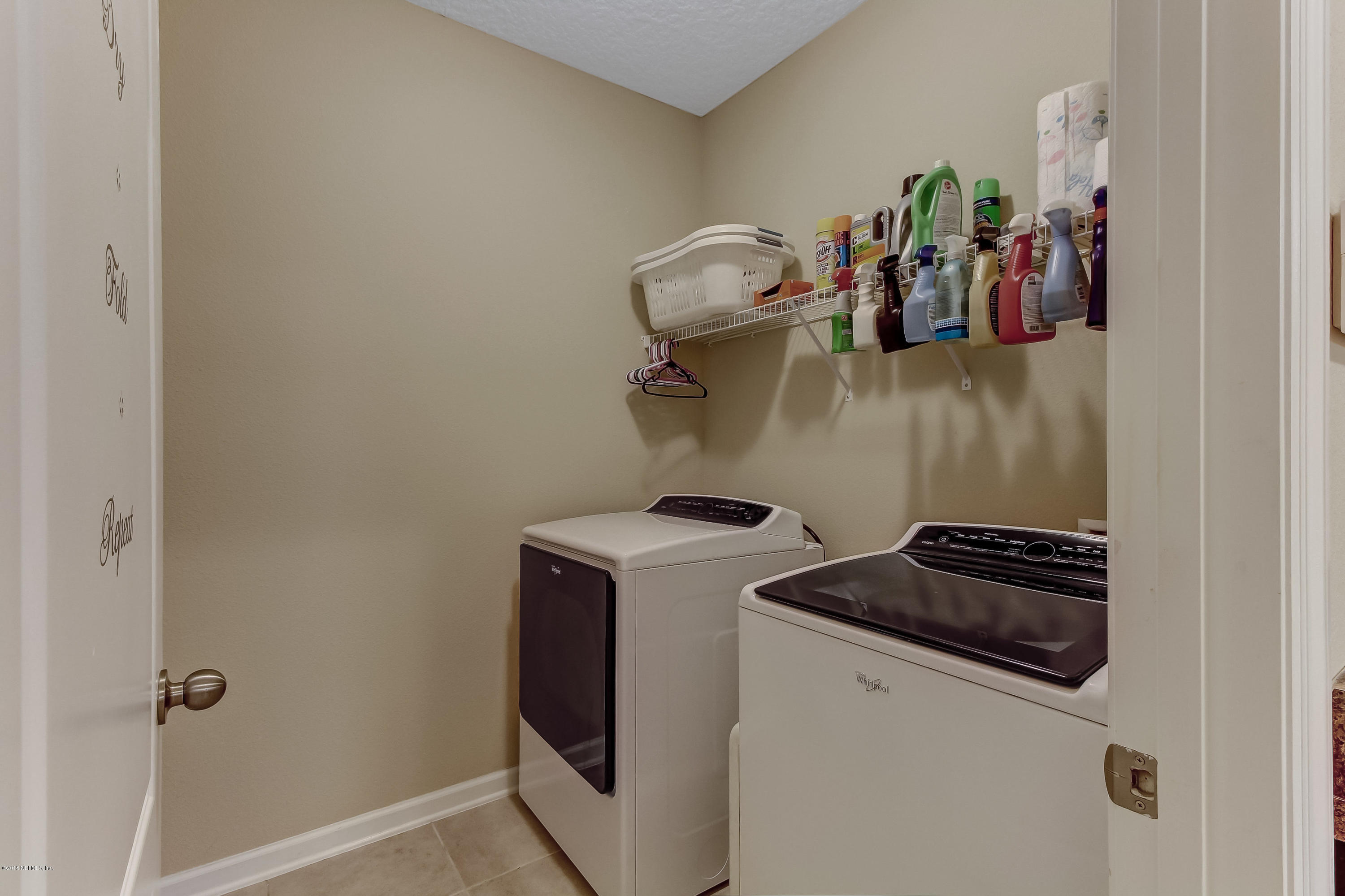 16480 Tisons Bluff Road Jacksonville, FL 32218 - Photo 27 of 80 a close view of a utility room with dryer and washer