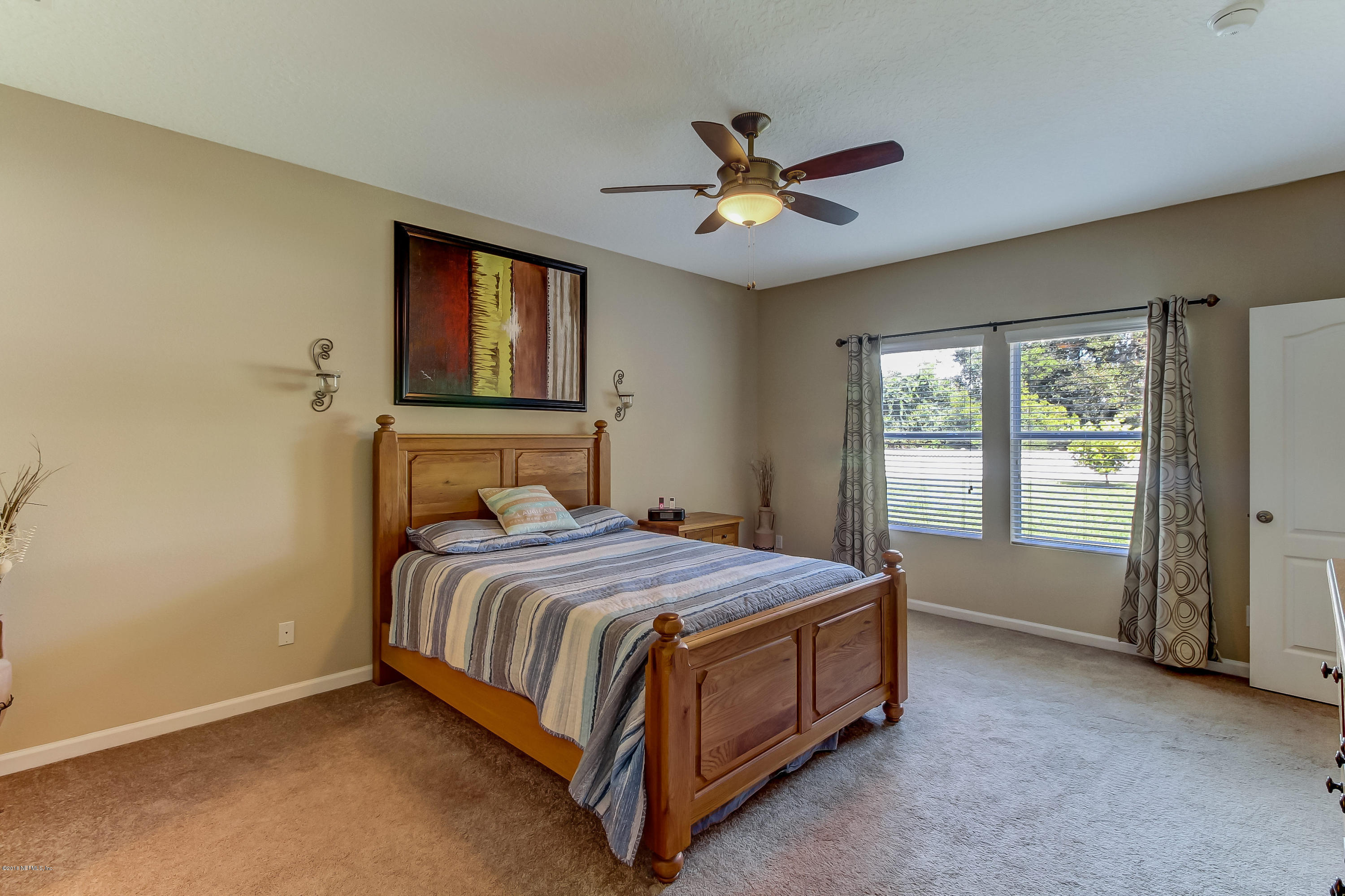 16480 Tisons Bluff Road Jacksonville, FL 32218 - Photo 30 of 80 a bedroom with a bed and window