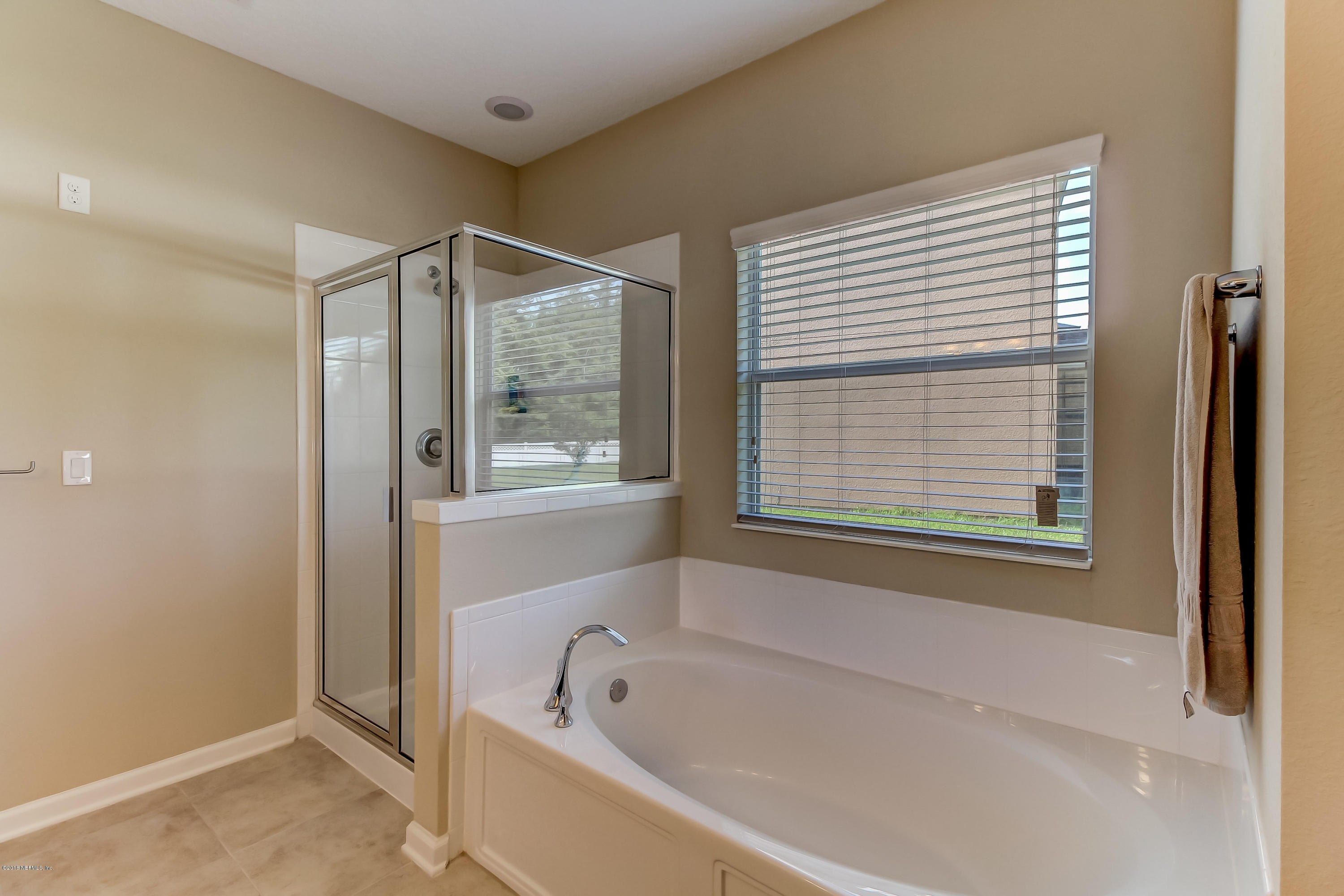 16480 Tisons Bluff Road Jacksonville, FL 32218 - Photo 34 of 80 a bathroom with a bathtub and a shower