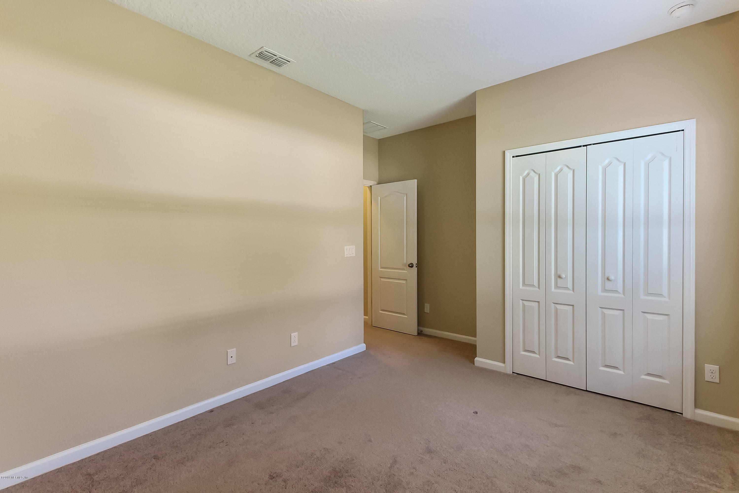 16480 Tisons Bluff Road Jacksonville, FL 32218 - Photo 40 of 80 an empty room with closet area