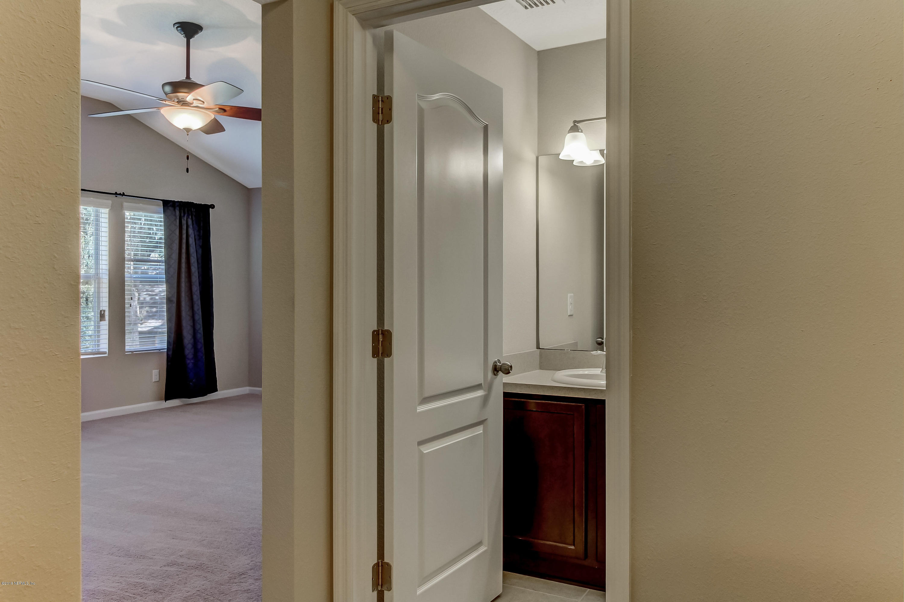 16480 Tisons Bluff Road Jacksonville, FL 32218 - Photo 49 of 80 a view of a hallway with wooden floor