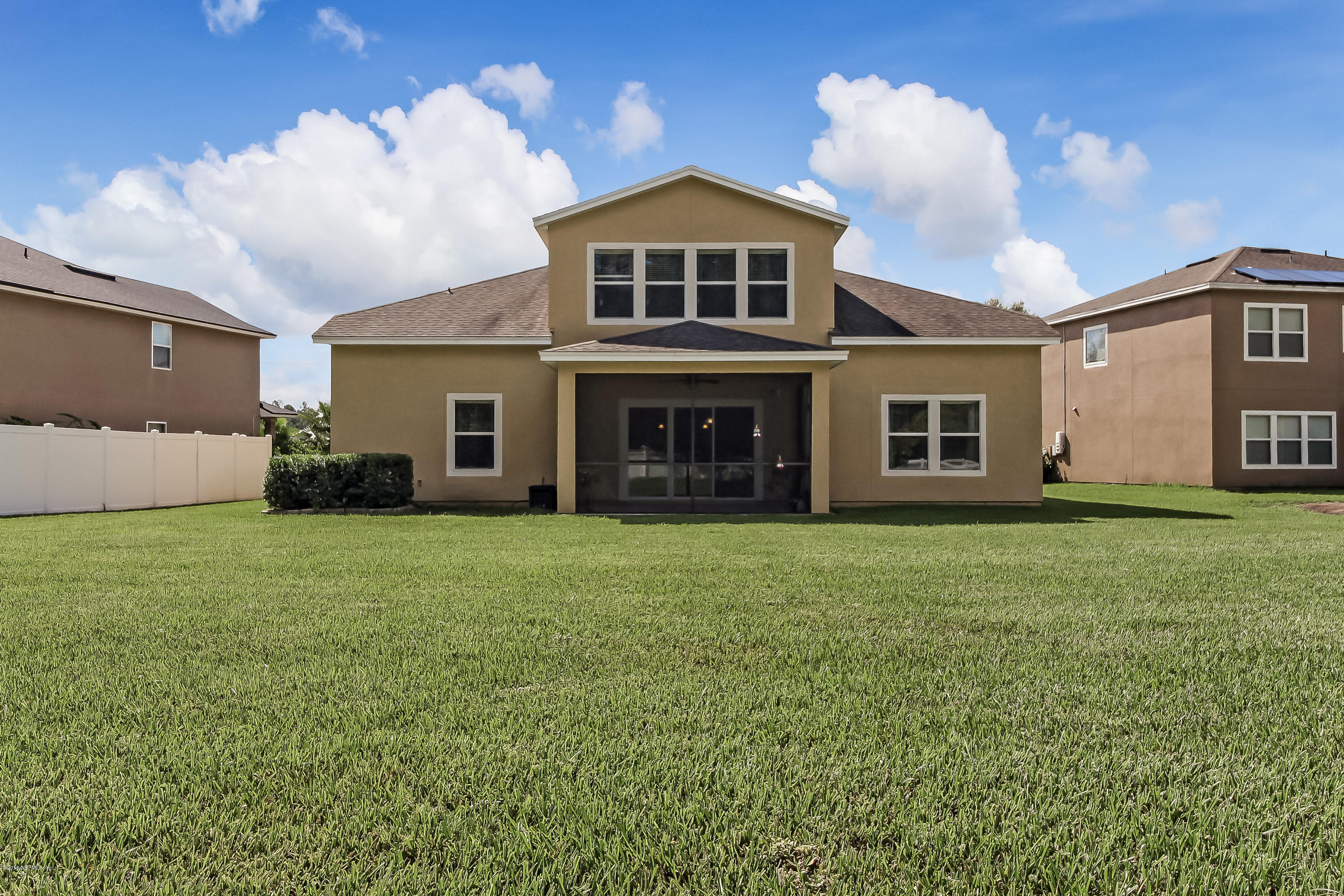 16480 Tisons Bluff Road Jacksonville, FL 32218 - Photo 58 of 80 a front view of a house with a yard and garage