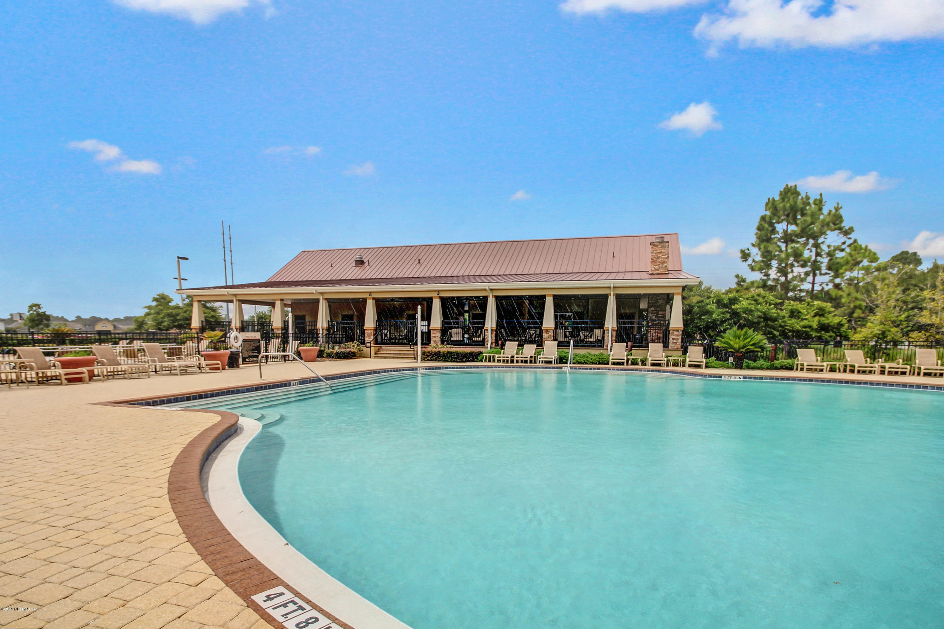 16480 Tisons Bluff Road Jacksonville, FL 32218 - Photo 63 of 80 a swimming pool with outdoor seating and yard