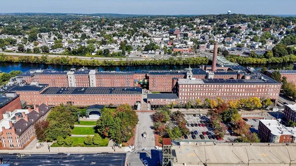 a front view of a house with glass windows