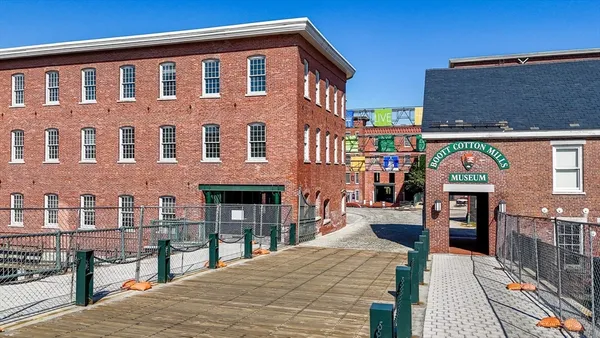 a car parked in front of a brick building